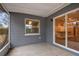 Inviting screened patio with sliding glass doors, offering a glimpse into the interior and a seamless transition to the outdoors at 7030 19Th N Way, St Petersburg, FL 33702