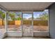 Screened patio with a clear view of the backyard, offering a serene outdoor space for relaxation and enjoying the surroundings at 7030 19Th N Way, St Petersburg, FL 33702