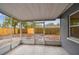 Enclosed patio offering a view of the backyard and an outdoor living space, perfect for relaxation and entertainment at 7030 19Th N Way, St Petersburg, FL 33702