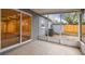 Screened patio with sliding glass doors, offering a view of the backyard and extending the living space outdoors at 7030 19Th N Way, St Petersburg, FL 33702
