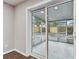 Sliding glass door from the living room provides access to a screened-in patio at 7030 19Th N Way, St Petersburg, FL 33702