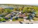 A high-angle view of several homes, a nearby highway, and abundant green trees at 7213 Trinity Pl, Tampa, FL 33610