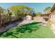 Fenced backyard with a storage shed and partially covered patio, perfect for outdoor activities at 7213 Trinity Pl, Tampa, FL 33610