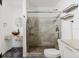 Bathroom featuring unique sink, granite countertops, and glass-enclosed tiled shower at 7213 Trinity Pl, Tampa, FL 33610