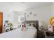 Bright bedroom with a comfortable bed, decorative mirrors, and a quaint vanity area at 7213 Trinity Pl, Tampa, FL 33610