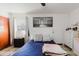 Bedroom with ceiling fan, neutral decor, and large wall art at 7213 Trinity Pl, Tampa, FL 33610