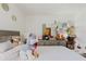 Bedroom featuring a comfortable bed, neutral decor, dresser and vanity at 7213 Trinity Pl, Tampa, FL 33610