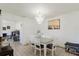 Dining room with stylish chandelier next to the kitchen and living spaces at 7213 Trinity Pl, Tampa, FL 33610