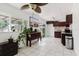 Eat-in kitchen featuring lots of counter space, modern appliances, natural light, and a tile floor at 7213 Trinity Pl, Tampa, FL 33610