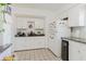This kitchen features white cabinets and modern appliances, creating a bright culinary space at 7213 Trinity Pl, Tampa, FL 33610