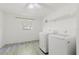 Bright laundry room with modern washer and dryer at 7213 Trinity Pl, Tampa, FL 33610