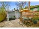 Charming backyard with a patio, storage shed, outdoor seating, and unique aquarium feature at 8306 N 10Th St, Tampa, FL 33604