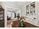 Bright dining room featuring built-in shelving with an open view to the living area at 8306 N 10Th St, Tampa, FL 33604
