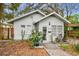 Charming single-story home with a well-maintained yard and neutral color palette at 8306 N 10Th St, Tampa, FL 33604