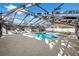 Inviting screened-in pool area with ample deck space, perfect for relaxation and entertainment at 8701 Elmdale Pl, Tampa, FL 33637