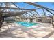 Spacious enclosed pool area offering a refreshing escape with ample deck space and natural light at 8701 Elmdale Pl, Tampa, FL 33637