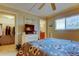 Bedroom features walk-in closet, TV, and en suite bathroom at 936 Pinellas Bayway S # T-7, Tierra Verde, FL 33715