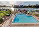 Community pool overlooks waterfront and neighborhood docks and has lounge seating at 936 Pinellas Bayway S # T-7, Tierra Verde, FL 33715