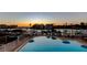 Community pool overlooks waterfront and neighborhood docks at sunset at 936 Pinellas Bayway S # T-7, Tierra Verde, FL 33715
