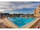 Community pool overlooks waterfront and neighborhood docks and has lounge seating at 936 Pinellas Bayway S # T-7, Tierra Verde, FL 33715