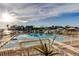Community pool is surrounded by lounge seating and overlooks the neighborhood harbor at 936 Pinellas Bayway S # T-7, Tierra Verde, FL 33715