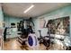 Home exercise room with workout machines, bookshelf, and mirrors at 936 Pinellas Bayway S # T-7, Tierra Verde, FL 33715