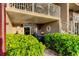 Covered outdoor patio featuring a dining set and lush greenery at 936 Pinellas Bayway S # T-7, Tierra Verde, FL 33715