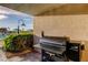 Outdoor Traeger grill area on patio is perfect for entertaining with view of community pool at 936 Pinellas Bayway S # T-7, Tierra Verde, FL 33715