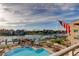 Aerial view of waterfront with pool, docks, and well-manicured landscaping at 936 Pinellas Bayway S # T-7, Tierra Verde, FL 33715