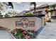 Exterior community sign for Castillo Del Sol with beautiful landscaping at 936 Pinellas Bayway S # T-7, Tierra Verde, FL 33715
