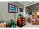 Comfortable sitting area with a ceiling fan, love seat, artwork, and lots of natural light at 936 Pinellas Bayway S # T-7, Tierra Verde, FL 33715