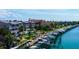 Scenic view of waterfront condos with boat docks, pools, and lush tropical landscaping at 936 Pinellas Bayway S # T-7, Tierra Verde, FL 33715