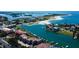 Stunning aerial view of waterfront condos, beach, and boat docks on a sunny day at 936 Pinellas Bayway S # T-7, Tierra Verde, FL 33715