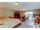 Cozy bedroom with twin beds, TV, and outdoor patio access showcasing beautiful views at 936 Pinellas Bayway S # T-7, Tierra Verde, FL 33715