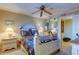 Well-lit bedroom with a decorative bed and a view to another room, creating an open and inviting space at 936 Pinellas Bayway S # T-7, Tierra Verde, FL 33715