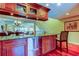 Well-appointed kitchen with granite countertops, wine rack, stainless steel dishwasher and seating at 936 Pinellas Bayway S # T-7, Tierra Verde, FL 33715