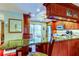 Kitchen with cherry wood cabinets, stainless steel appliances, and breakfast bar at 936 Pinellas Bayway S # T-7, Tierra Verde, FL 33715