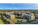The aerial shot displays the community's arrangement, with condos, a pool, landscaping, and water features enhancing appeal at 960 Starkey Rd # 3406, Largo, FL 33771