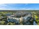 Expansive aerial view of condo community and water features under a blue sky at 960 Starkey Rd # 3406, Largo, FL 33771
