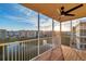 Screened balcony with scenic views of a pond and buildings, complete with a ceiling fan at 960 Starkey Rd # 3406, Largo, FL 33771