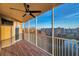 Screened balcony with tranquil views of a pond, buildings, and a ceiling fan for comfort at 960 Starkey Rd # 3406, Largo, FL 33771