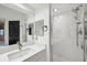 Bathroom showcasing a vanity with white cabinets, quartz countertop and a glass enclosed walk-in shower at 960 Starkey Rd # 3406, Largo, FL 33771