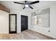 This bedroom features modern ceiling fan and a closet with a view to another bedroom at 960 Starkey Rd # 3406, Largo, FL 33771