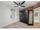 Bedroom with hardwood floors, a murphy bed, and natural light streaming through the windows at 960 Starkey Rd # 3406, Largo, FL 33771