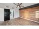 Bedroom featuring wood floors, and an accent wall at 960 Starkey Rd # 3406, Largo, FL 33771