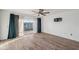 Bedroom features hardwood floors, balcony, and a ceiling fan providing comfort and style at 960 Starkey Rd # 3406, Largo, FL 33771