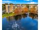 Scenic view of the apartment complex with a fountain in the foreground, showcasing the waterfront setting at 960 Starkey Rd # 3406, Largo, FL 33771