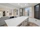 Kitchen with large quartz island, modern gray cabinets, and hardwood floors for a sleek look at 960 Starkey Rd # 3406, Largo, FL 33771