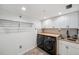 Well-lit laundry room with modern washer/dryer, sink, and wooden countertop at 960 Starkey Rd # 3406, Largo, FL 33771