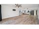 An open-concept layout connecting living room to modern kitchen featuring seamless hardwood flooring at 960 Starkey Rd # 3406, Largo, FL 33771